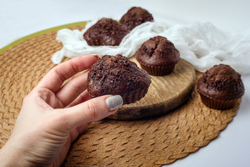 Chocolate muffins. Delicious cupcakes on white table.