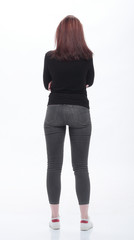 rear view . casual young woman looking at white screen