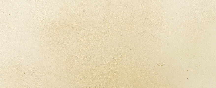close up retro plain cream color cement wall panoramic background texture for show or advertise or promote product and content on display and web design element concept	