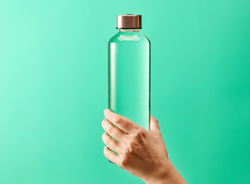 Refillable Drinking Water Bottle On Mint Green Background