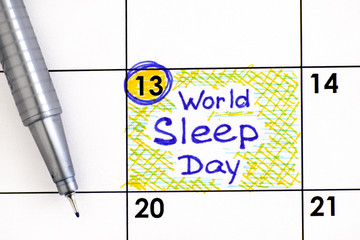 Reminder World Sleep Day in calendar with pen.