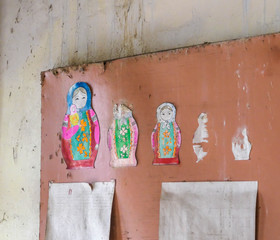 Matryoshka doll pictures pinned to a wooden board in an abandoned kindergarten in Pripyat, Ukraine....