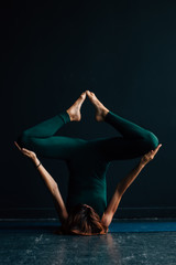 girl doing yoga in a dark place