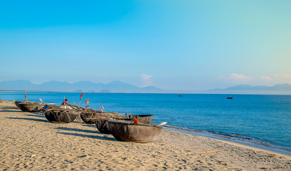 Traditional round basket boats made from bamboo, on the beach and other coastal regions of center Vietnam