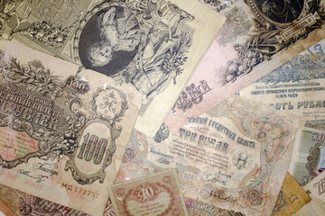 Fototapeta na wymiar Background of various vintage banknotes of Russia of different denominations