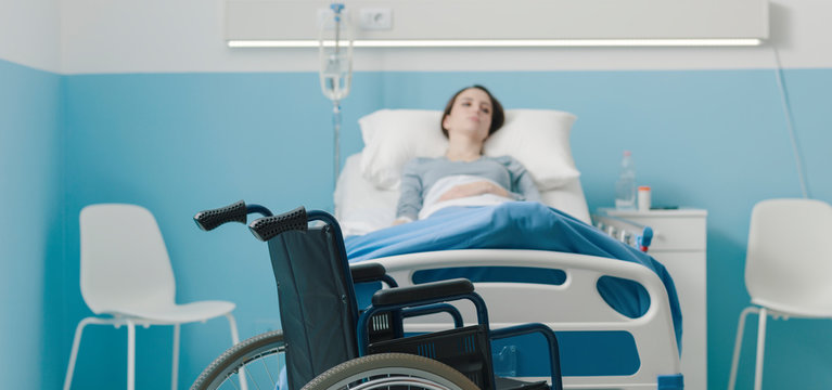 Hospitalized patient lying in bed and wheelchair