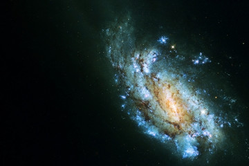 A beautiful galactic spiral in dark space. Elements of this image were furnished by NASA.