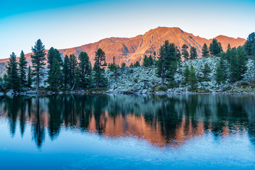 Naklejka premium Mountains, peaks, lake, everlasting ice and trees landscape. Knapenweg natural environment. Hiking in the alps, Tirol, Austria, Europe
