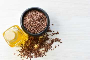 Flaxseed or flaxseed seeds, accompanied by oil (Linum usitatissimum) displayed in containers