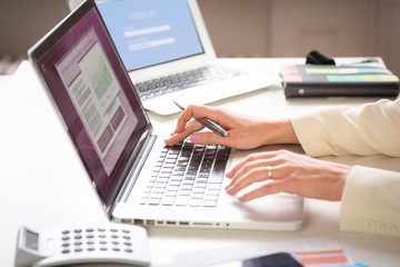 Businesswoman's hand typing on the keyboard