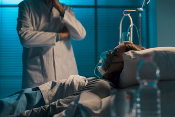 Professional doctor checking a patient at night
