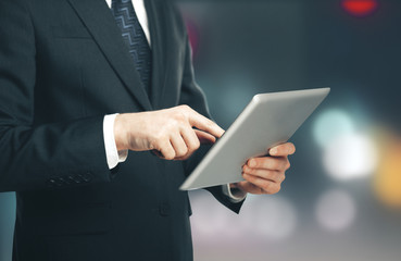 Businessman using digital tablet.