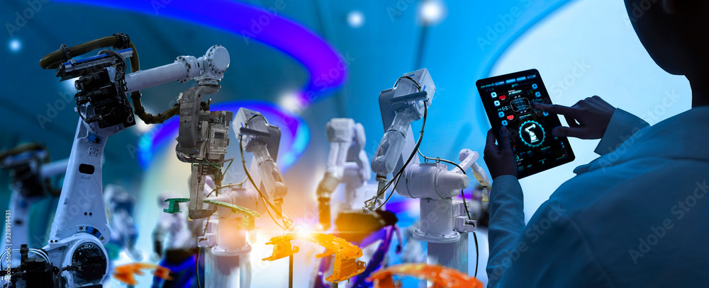 Poster Factory Female Industrial Engineer working with automation robot arms machine in intelligent factory industrial on real time monitoring system software.Digital future manufacture.