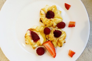 puff pastry cookies with organ and raspberries, strawberries