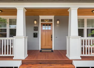 Fotobehang Covered porch and front door of beautiful new home © bmak