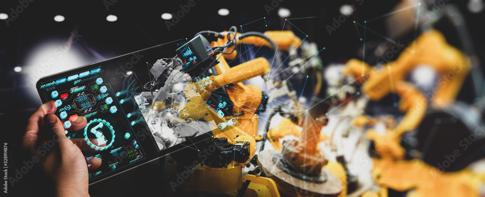 Poster Engineer hand using digital tablet and checking welding robotics automatic arms machine. Augmented reality in intelligent factory  industrial with monitoring system software.