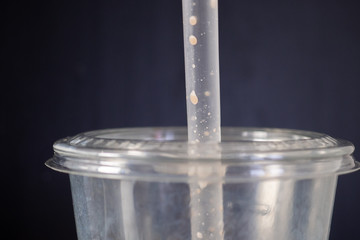 plastic takeaway cup and straws 
