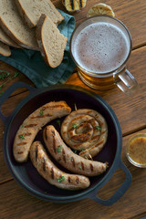 grilled sausages with a glass of beer
