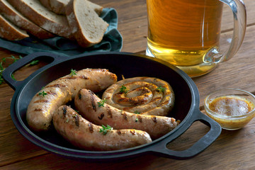 grilled sausages with a glass of beer