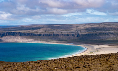 Beach By The Arctic Sea In Iceland with crystal water