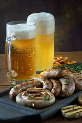 grilled sausages with a glass of beer