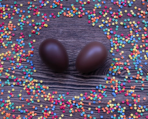 chocolate easter eggs on wooden background