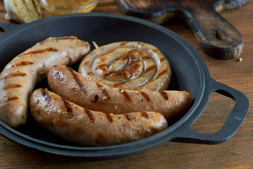 grilled sausages with a glass of beer