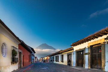 Old town in Antigua Guatemala with the volcano fire