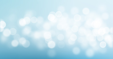 Bokeh light on blue background, sky with circle glitter light blur. Abstract soft glowing snow with vivid bright light and bokeh blur effect © Ron Dale