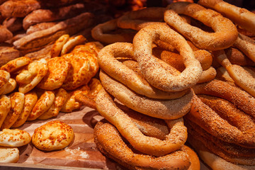 Bagels with sesame seeds are sold on the counter. Bread Supermarket