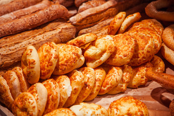 Long buns with seeds are sold in the store.