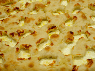 Delicious Italian pizza cooked in the wood oven with different kind of melted cheese