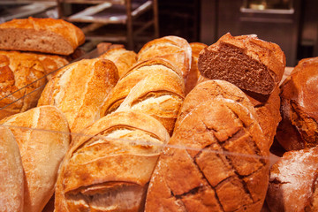 Fresh brittle bread of different types. On a shelf in a store