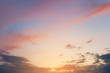 Colorful sunset sky over the horizon. Layered clouds.