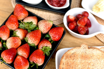 Healthy breakfast, Fresh red strawberry fruit from organic farm serving with homemade toasted bread.