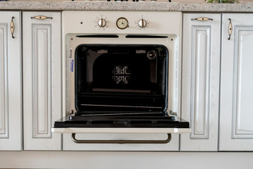 opened oven of cook on the kitchen at home