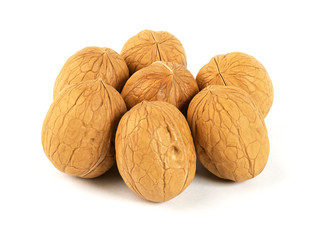 Delicious whole walnuts, isolated on white background