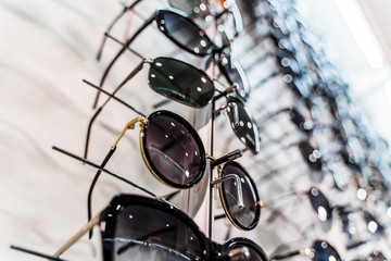 Raw of fashion elegance sunglasses in the store.