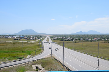 The road crossing is adjacent to secondary road.