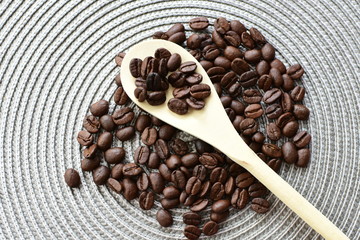 Colombian coffee beans, displayed in containers and spoons