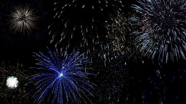 Colorful fireworks on black background. Seamlessly loop 4K 50 fps realistic animation. Beautiful holiday pyrotechnic show.