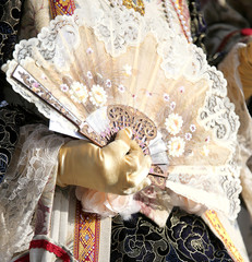 lady with glove and the fan in hand