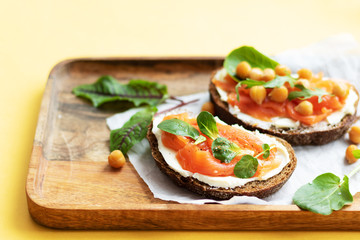 Breakfast starts a brisk day. Sandwich with slightly salted salmon, chickpeas and seasonal herbs....