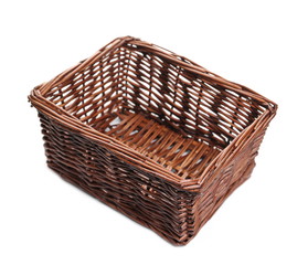 Obraz premium Empty wooden wicker basket isolated on white background