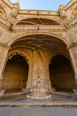 Cloister's ornate facade at the historic Manueline style Mosteiro dos Jeronimos (Jeronimos Monastery) in Belem, Lisbon, Portugal.