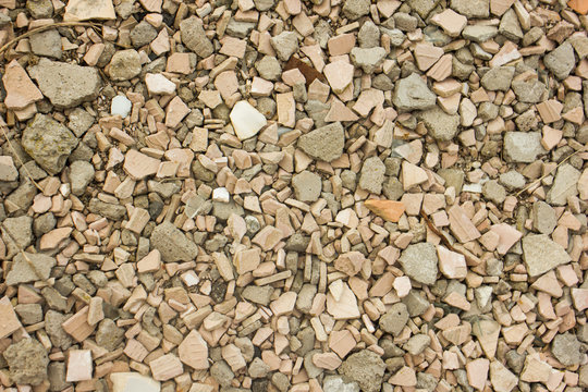 abstract stone wall background, colored stones on the ground