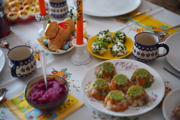 Fototapeta na wymiar Easter table with traditional dishes and cakes