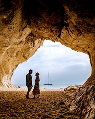 Sardinia Orosei coast Italy, men and woman, young couple adult on vacation at the Island of...