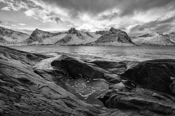 Panorama of snowy fjords and mountain range, Senja, Norway Amazing Norway nature seascape popular tourist attraction. Best famous travel locations. beautiful sunset within the amazing winter landscape