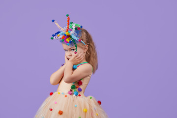 Childrens birthday party, masquerade. Little happy toddler child girl in a puffy tutu fancy dress,...